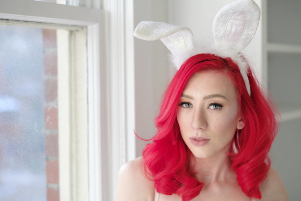 playboy styled themed boudoir shoot pink haired woman in bunny ears portrait boudoir