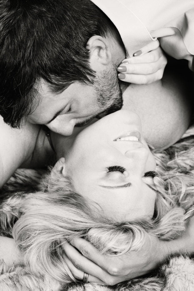 boudoir portrait couples session kiss sensual suggestive black and white