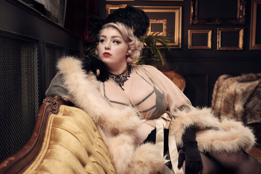 vintage themed boudoir session black lingerie and robe red lipstick blonde plus size posing tips