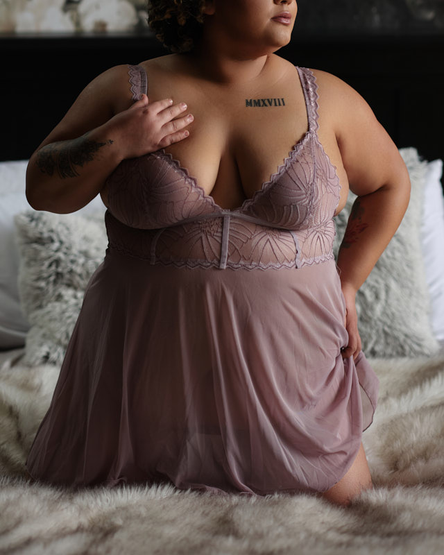 plus size woman in pink babydoll lingerie
